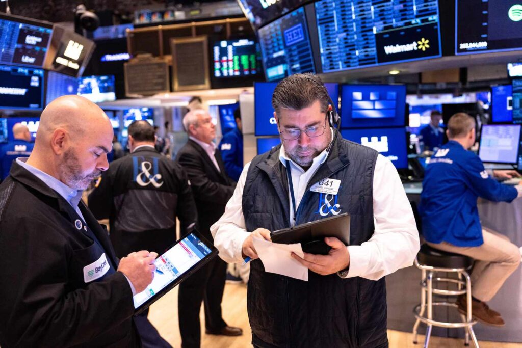 Traders work on the floor of the New York Stock Exchange