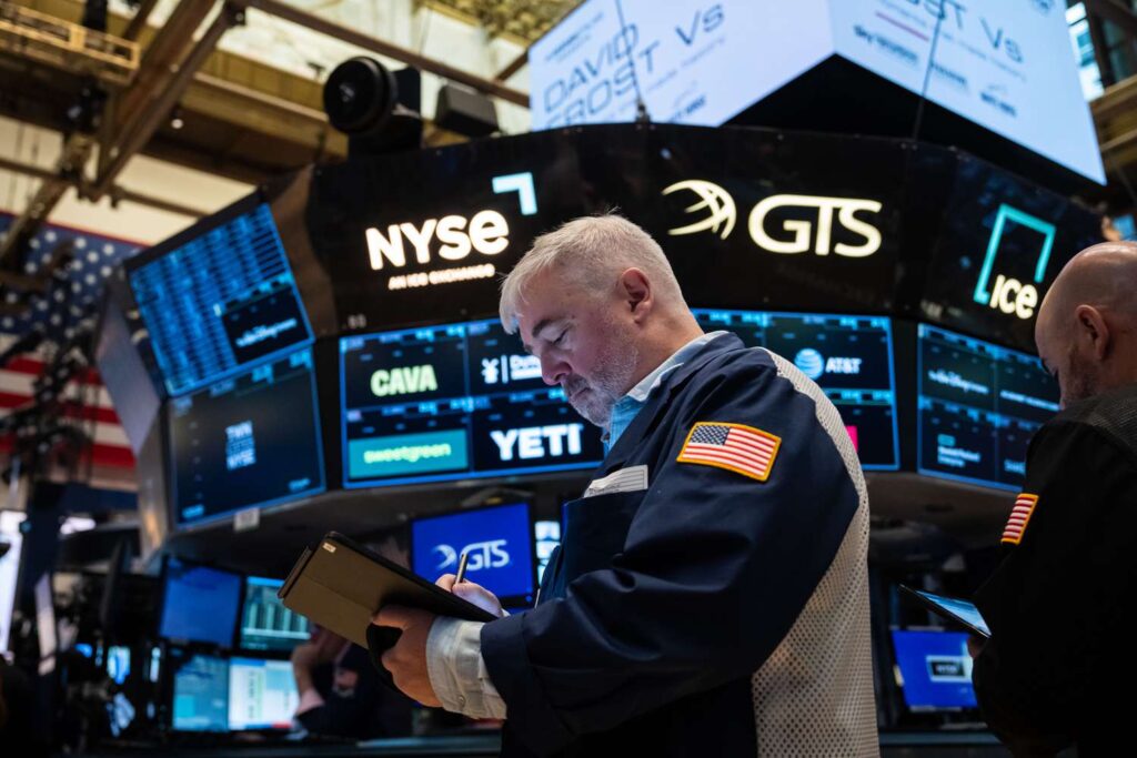Traders work on the floor of the New York Stock Exchange.