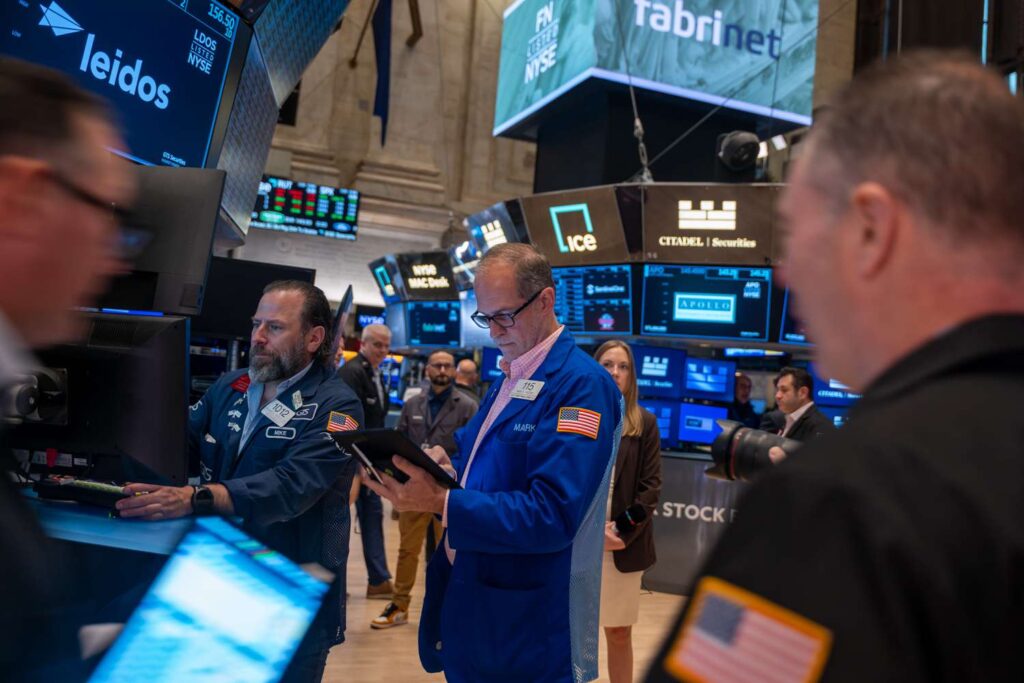 Traders work on the floor of the New York Stock Exchange (NYSE) on May 13, 2025 in New York City.