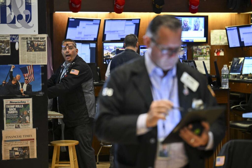 Traders work on the floor of the New York Stock Exchange