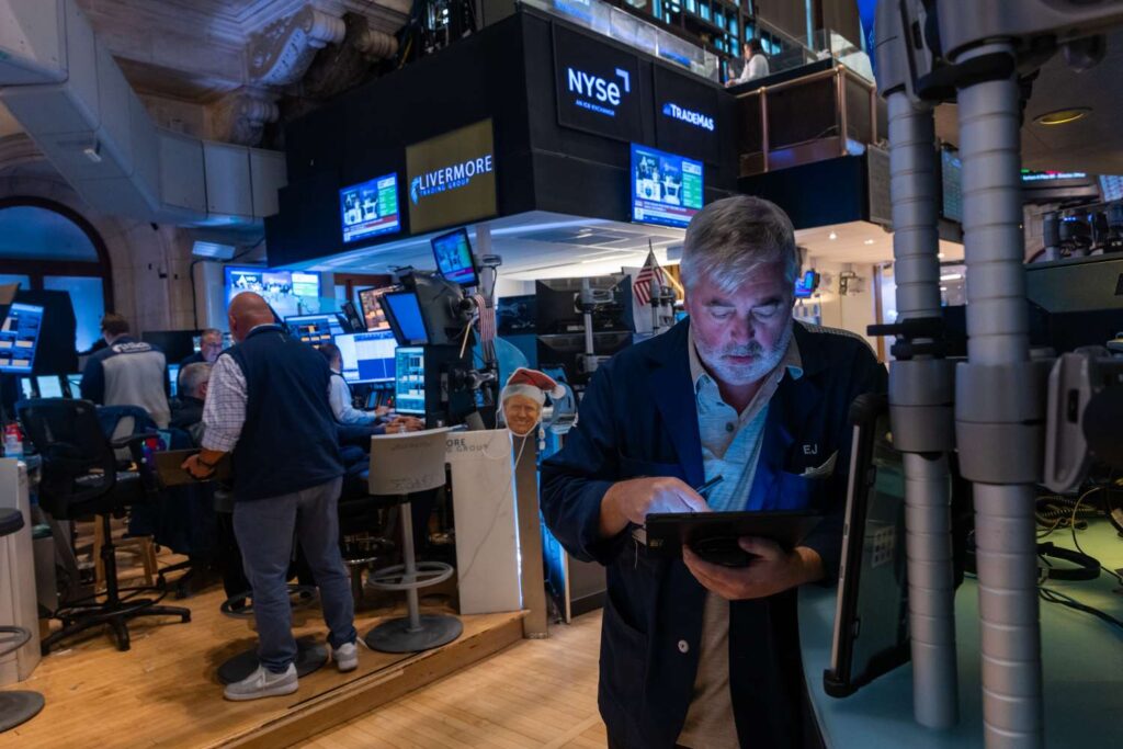 Traders work on the floor of the New York Stock Exchange