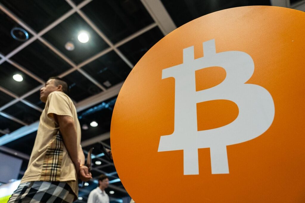 Bitcoin Rises to a Record as ‘Debasement’ Trade Spurs Risk Rally