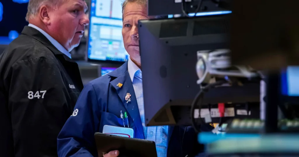 Dow drops nearly 800 points amid concerns over AI developments and tariff implications.