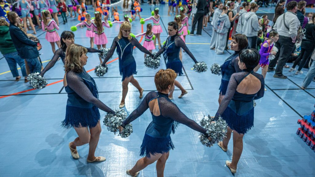 Ukrainian cheerleaders in midlife stand resilient in the face of conflict.