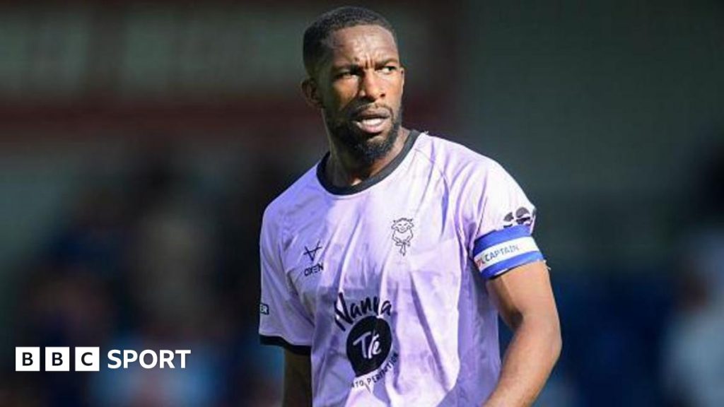 Cardiff City searches for supporter involved in alleged racist incident targeting Lincoln City captain Tendayi Darikwa.