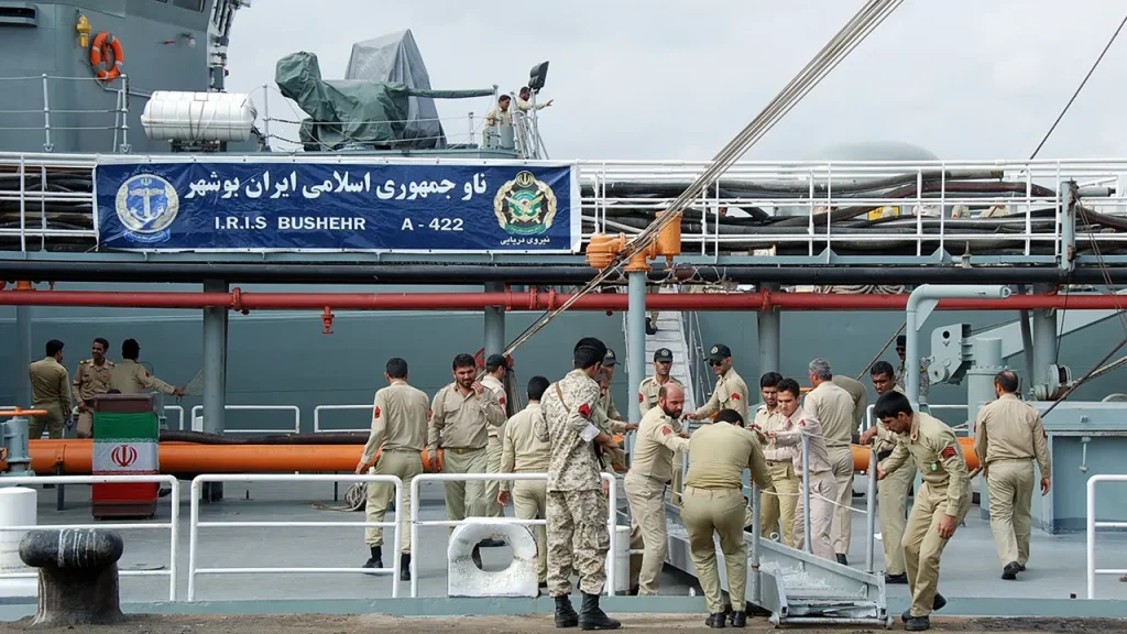 [Iranian vessel experiences engine trouble offshore shortly after US submarine's sinking of another ship.