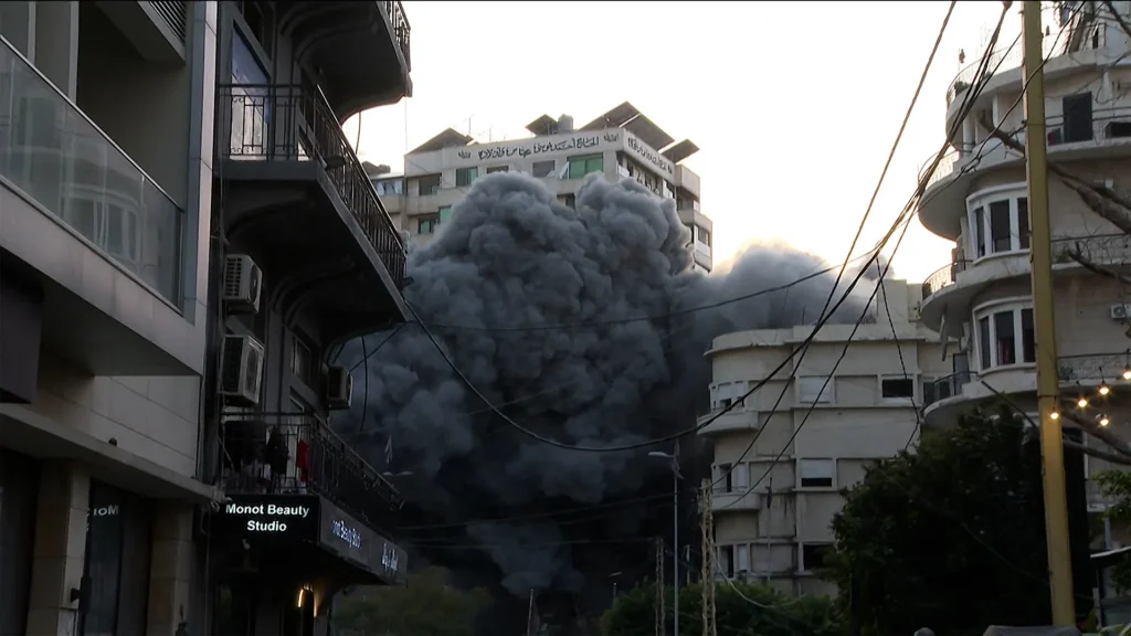 Israeli forces conduct airstrike on Beirut while Al Jazeera reports live.