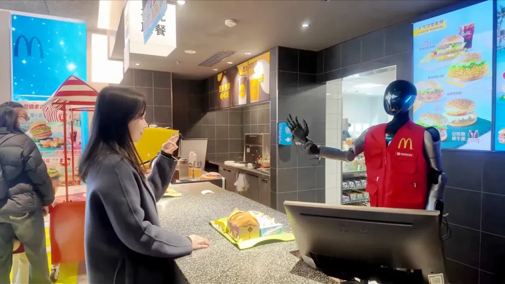 McDonald's trials Keenon Robotics' humanoid robots in Shanghai.