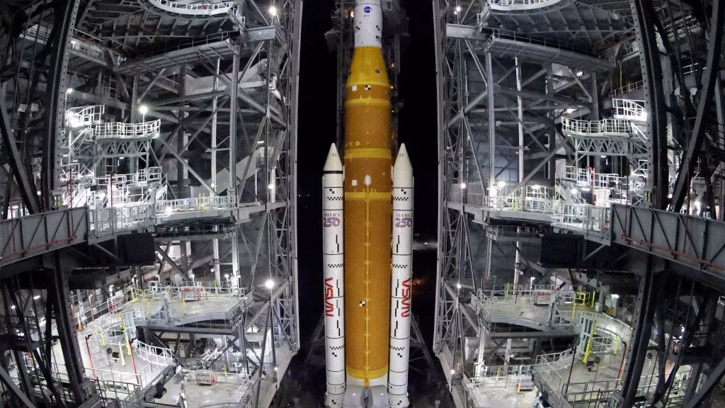 NASA transports refurbished lunar rocket from storage to launch site ahead of early April mission.