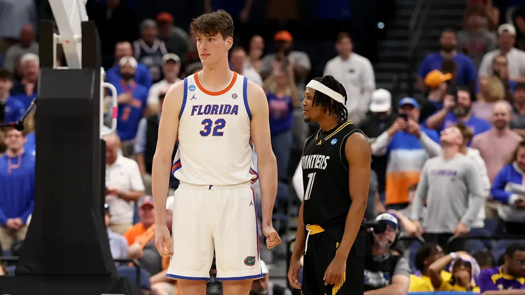 Olivier Rioux of Florida gains attention for his impressive height in recent NCAA tournament footage.