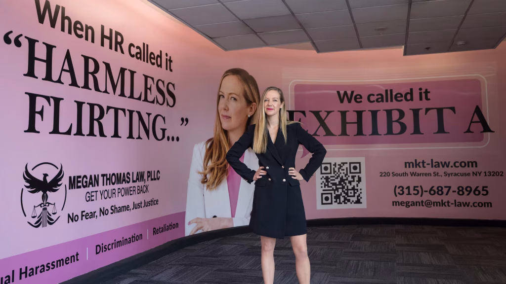 Attorney specializing in sexual harassment files lawsuit regarding denied airport advertisement, resulting in large billboard display.