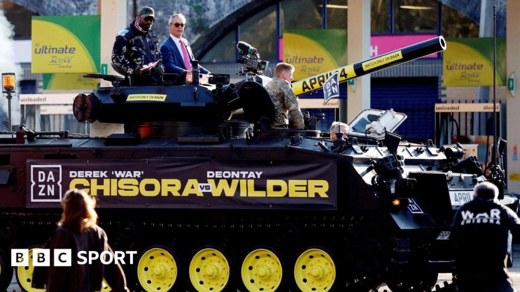 Chisora attends press event with Nigel Farage, arriving in a tank ahead of Wilder match