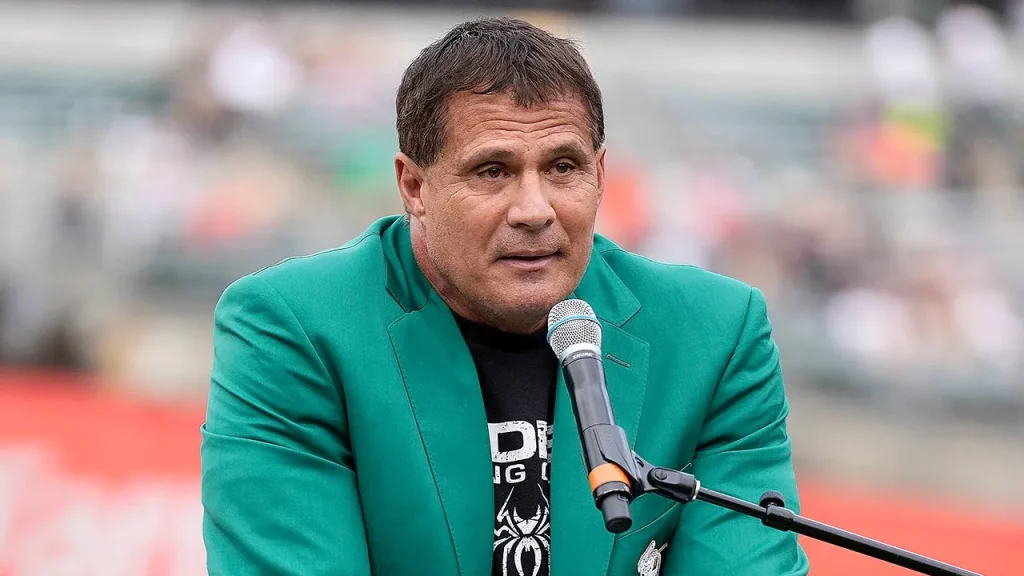 College outfielder accidentally deflects fly ball off head, resulting in unexpected home run.