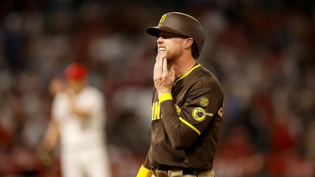 Jake Cronenworth of the Padres remains in the game following a 96 mph fastball to the face.