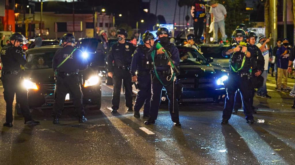Los Angeles agrees to settle for $11.8 million with individual injured by police projectile at Dodgers celebration.
