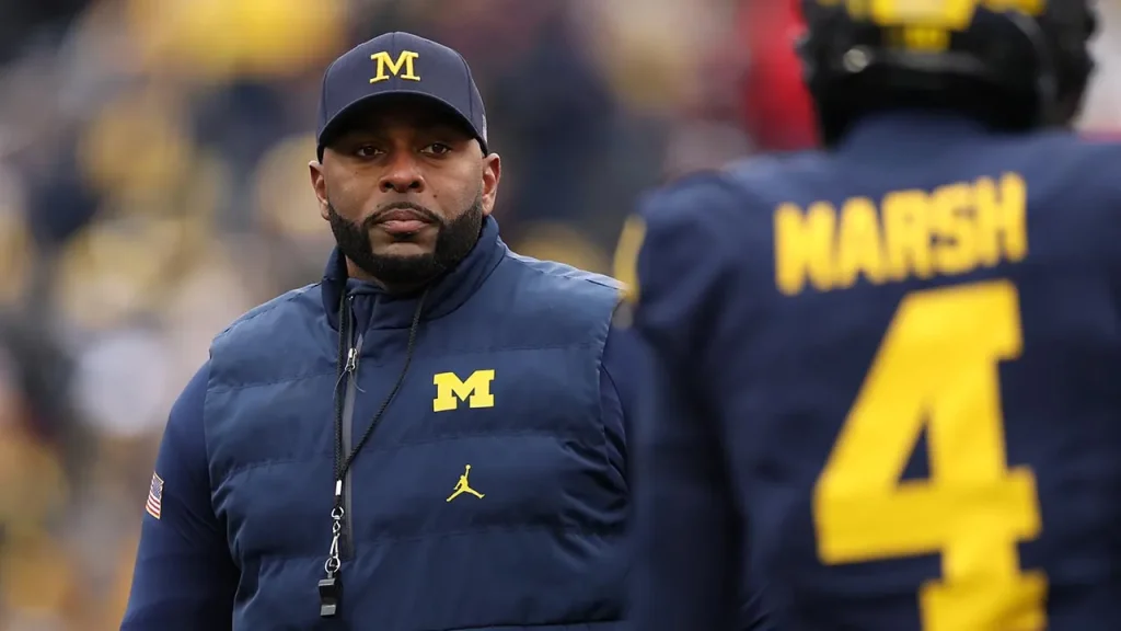 Michigan Athletic Director Warde Manuel expresses feelings of betrayal regarding Sherrone Moore's conduct.