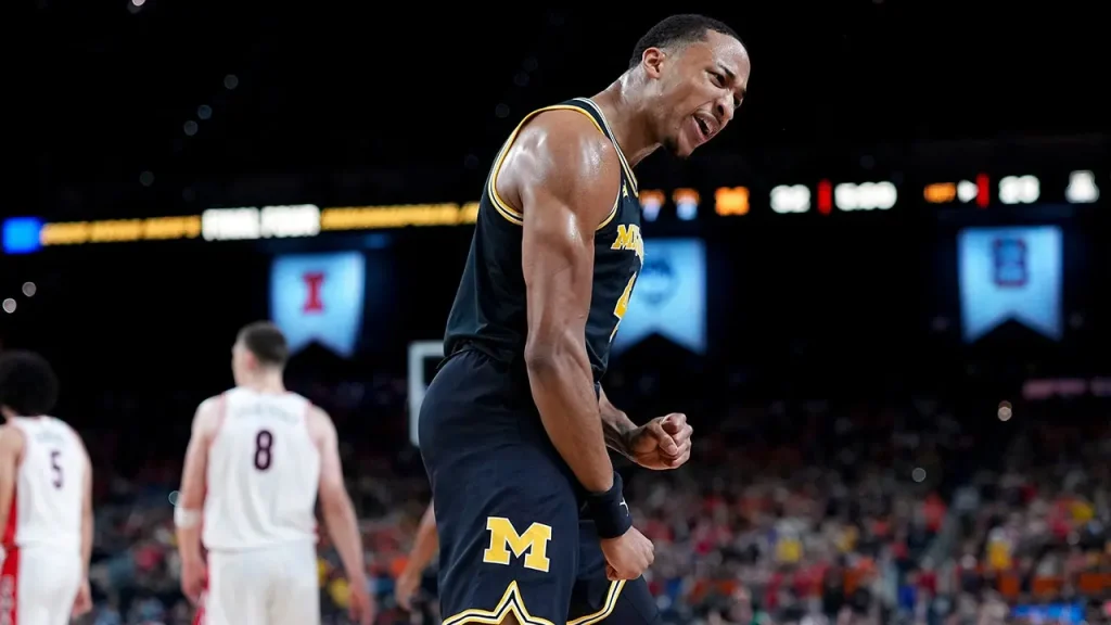 Michigan Wolverines dominate Arizona to advance to the national championship finals.