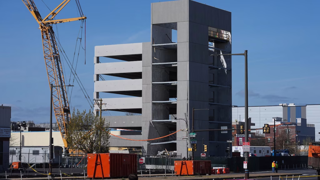 Remains of two workers discovered following partial garage collapse days earlier