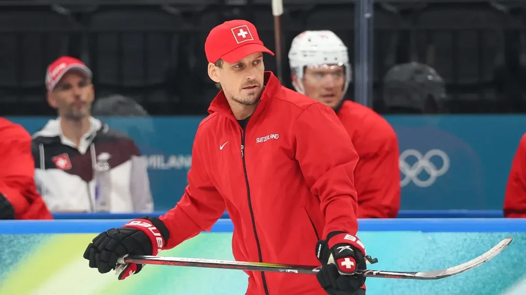 Swiss hockey coach Patrick Fischer dismissed following incident involving counterfeit COVID vaccination document.