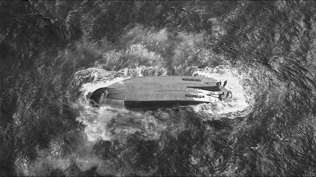 US Coast Guard discovers capsized boat near Saipan while searching for missing vessel.
