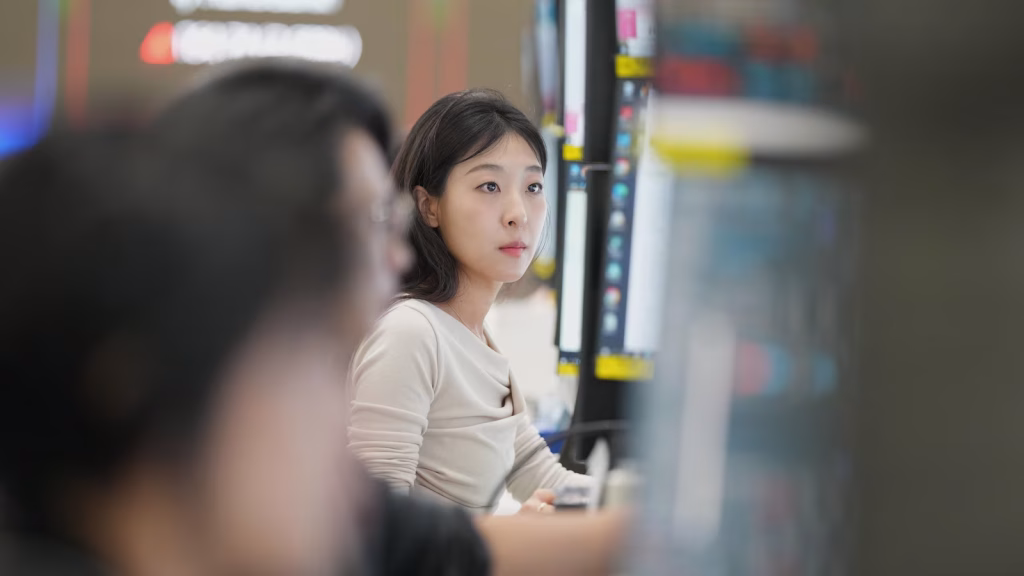 Asian markets show varied performance while oil prices remain stable following record highs on Wall Street.