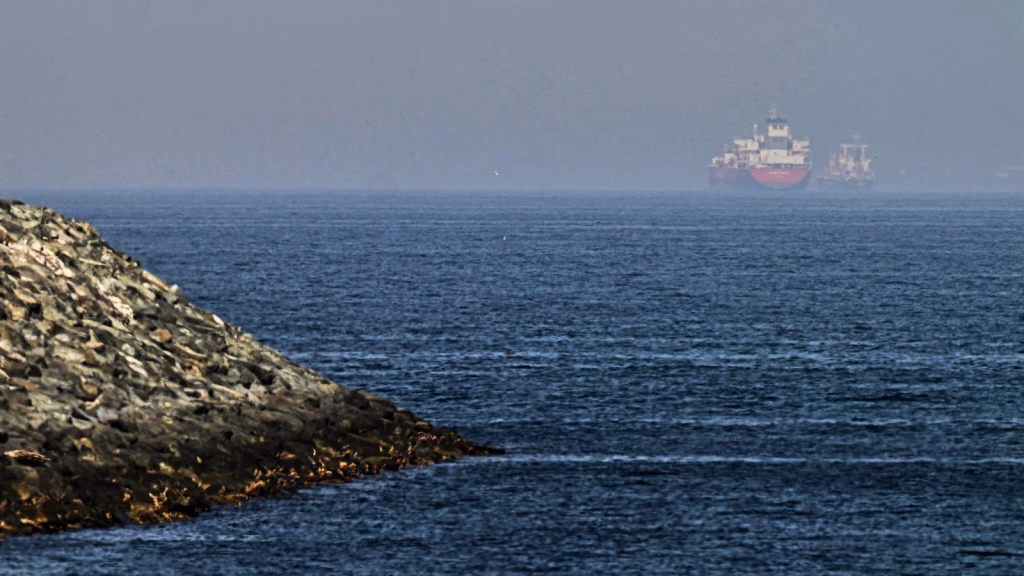 International coalition advises ships to change course as efforts begin to restore access to the Strait of Hormuz.