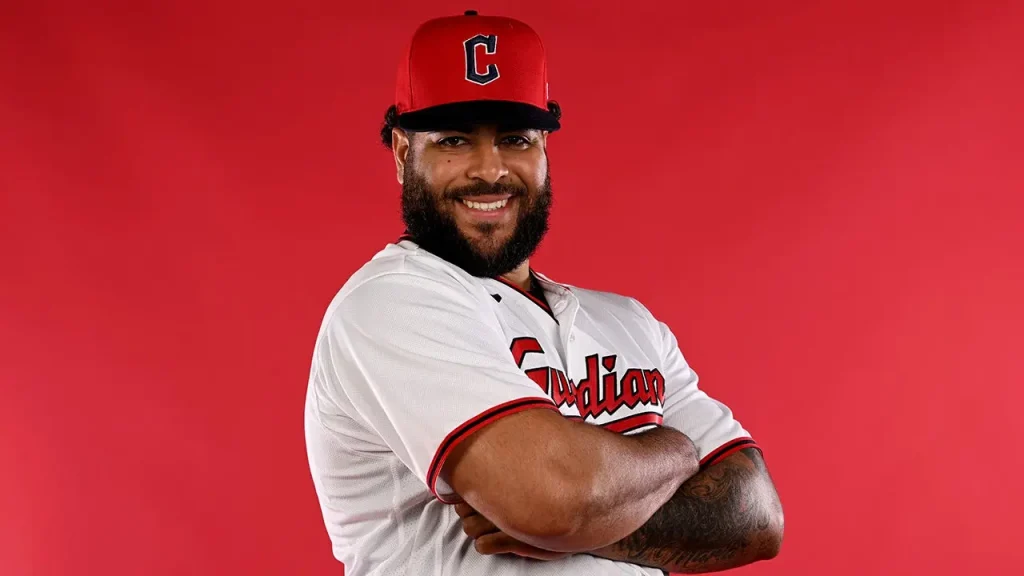Minor League pitcher celebrates exuberantly after making a catch on a soft line drive