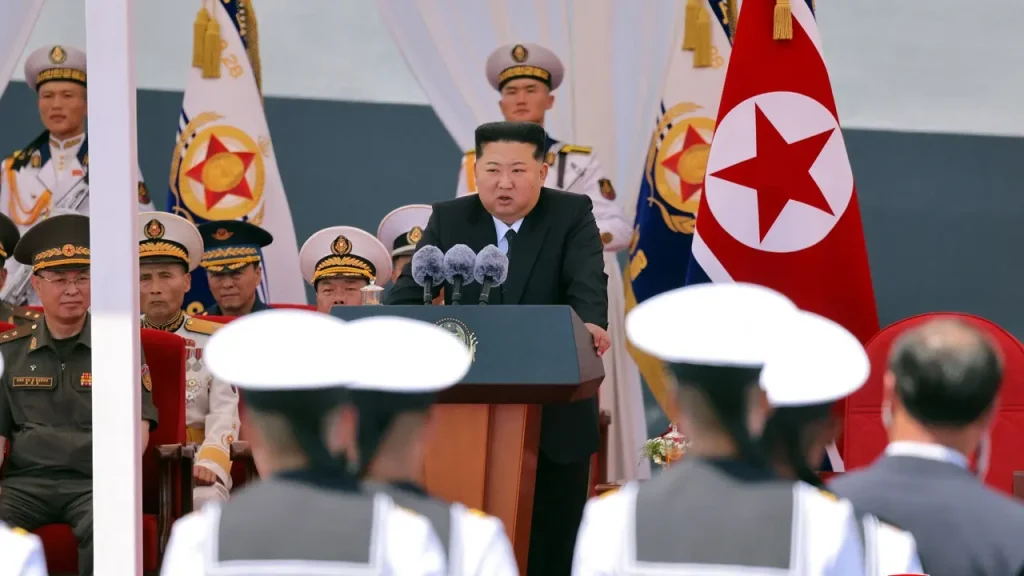 [Kim Jong Un announces plan to increase naval capabilities with the construction of two large warships annually, according to a report.