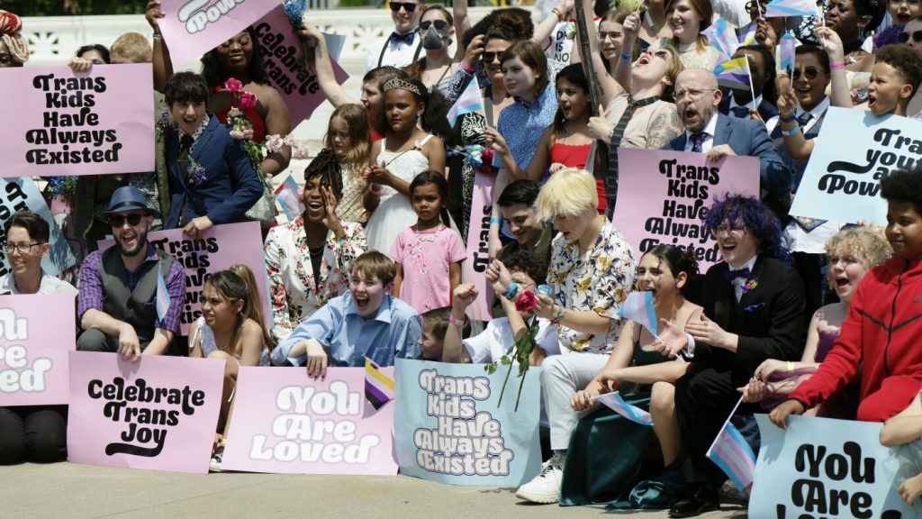 Mother of transgender teenager expresses concern and anger after Trump halts Medicaid funding.